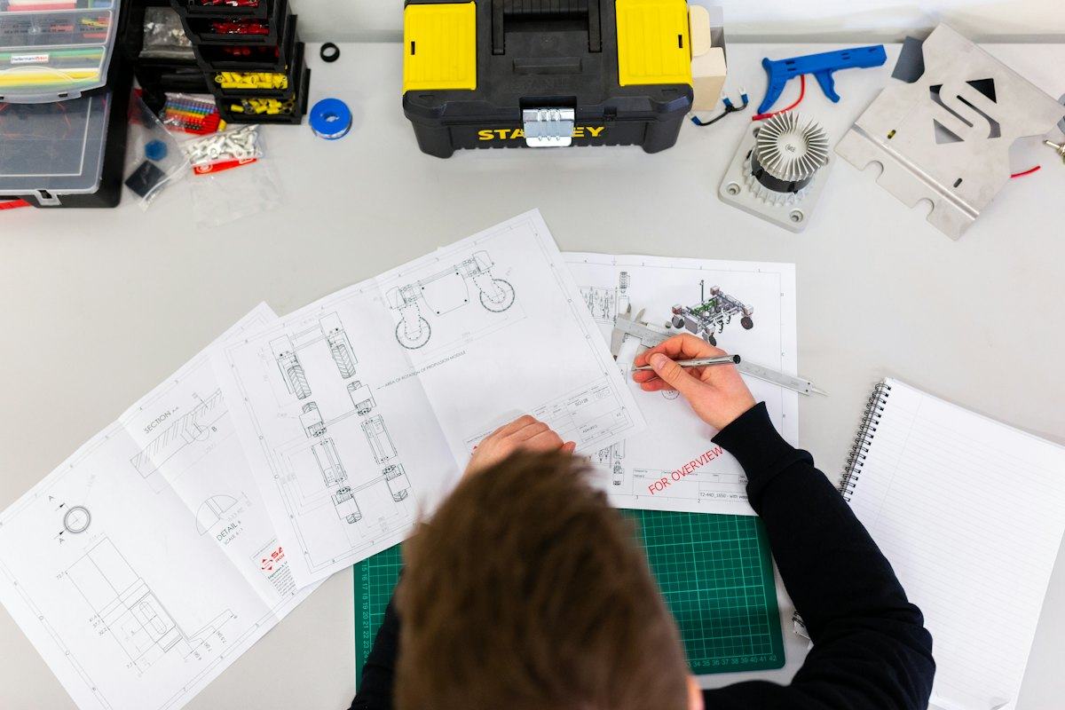 Estimate and plans laid out on a desk