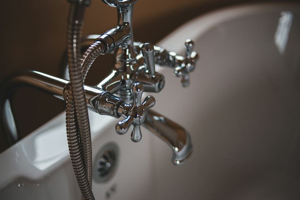 Newly installed chrome shower and bath fixtures