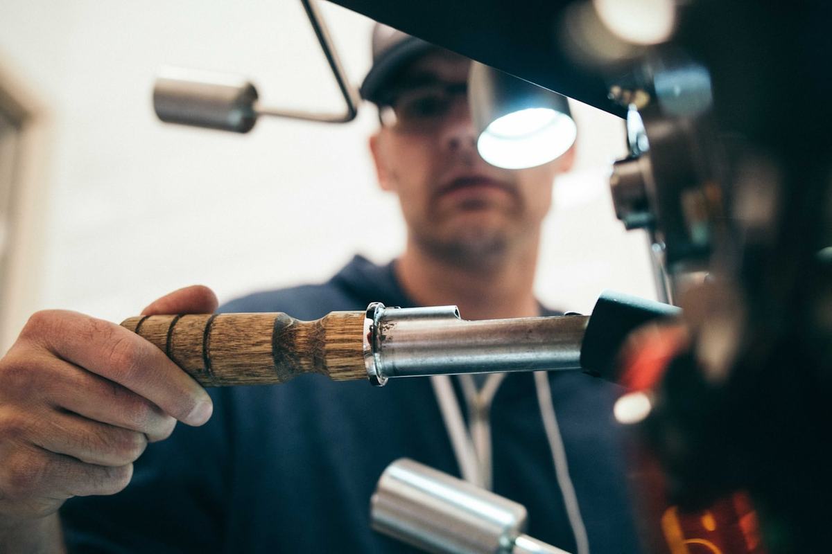 A Dorzi plumber working with a torch on site
